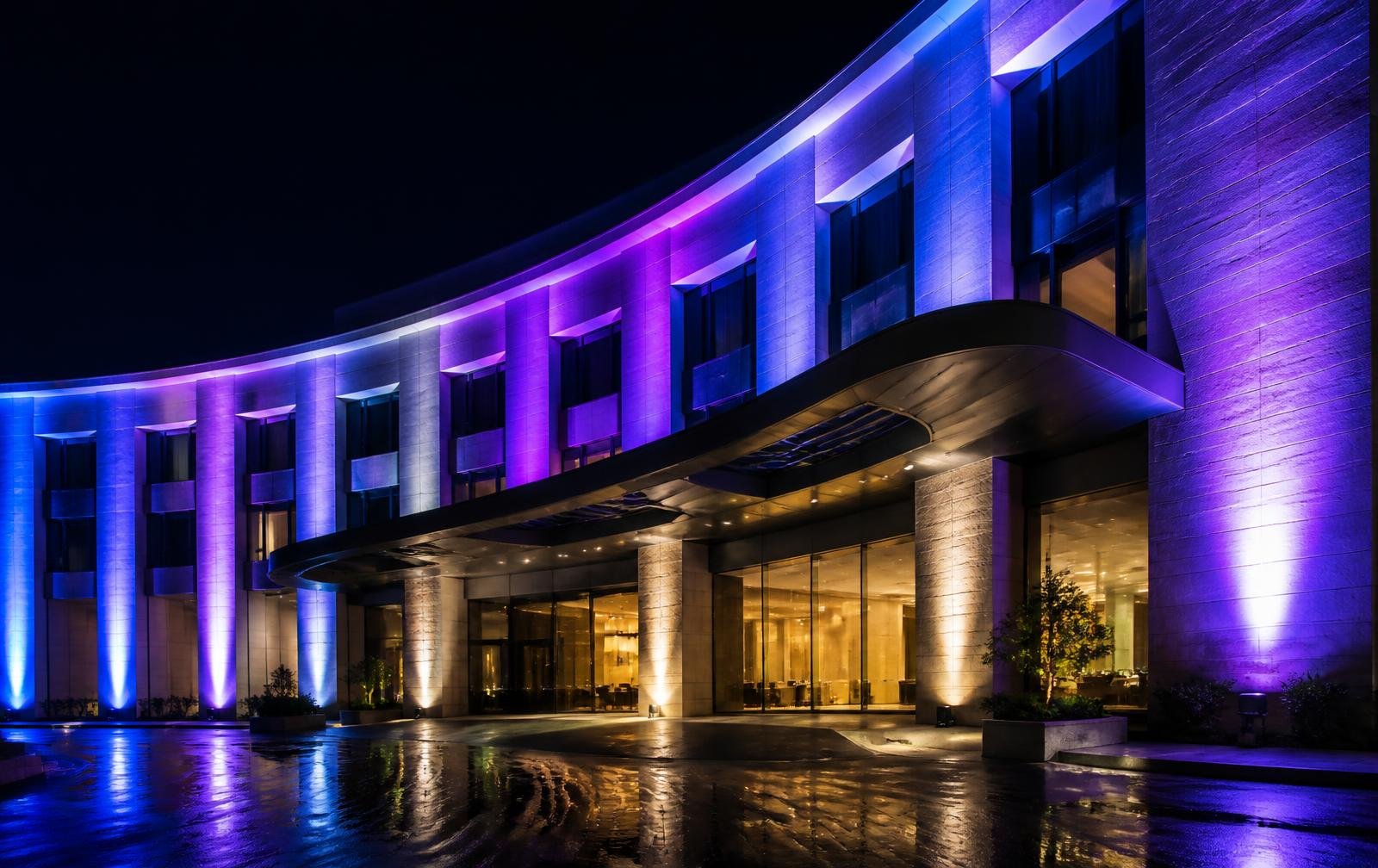 Façade illuminated with Kerr RGBW architectural lighting at night